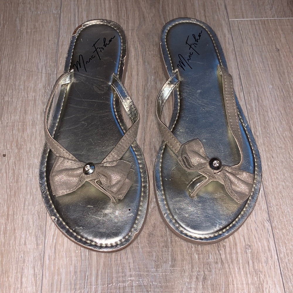 Marc Fisher gold metallic bow flip flips